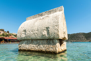 Wall Mural - Semi-submerged Lycian sarcophagus tomb by the shore of Kalekoy village of the Demre district in the Antalya Province of Turkey.