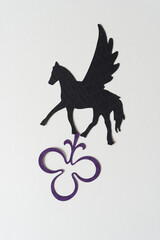 Wall Mural - glyph or dingbat of pegasus (winged horse) cutout and decorative trefoil shape