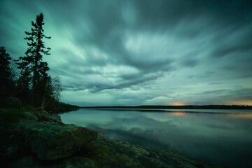 cloudy day over the secluded northern lake near la ronge, saskatchewan, canada