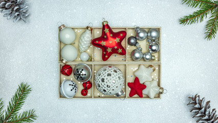 Wall Mural - christmas ornaments with stars, balls, gift box, pine cones and fir branches