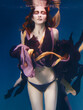 beautiful artistic young woman in dress dancing underwater. Mermaid, harvest, dance, fairy concept