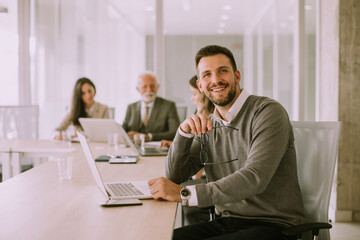 Young business man working on laptop in the office