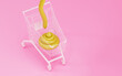 Yellow cartoon poop is in shopping cart. 3d render, 3d trendy illustration.
