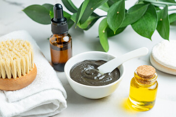 Poster - ingredients for homemade exfoliating body caly mask. spring skin renew and cellulite treatment. hand made organic cosmetics. esential oil, herbal extract and clay powder with massage brush.