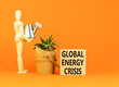 Global energy crisis symbol. Concept words Global energy crisis on wooden blocks. Businessman model. Beautiful orange table orange background. Business and global energy crisis concept. Copy space.