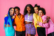 © oneinchpunch - Group of Beautiful black women posing in studio on colored background with colorful fashionable clothes style