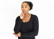 © KAMPUS - Portrait of confident young looking at camera. African American lady wearing black longsleeve posing against white background. Female beauty concept