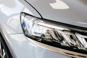 Wall Mural - Grey car headlight close up, beautiful car design