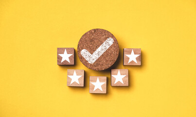 Fototapete - Correct sign mark withe five stars to round wooden on yellow background for best quality assurance guarantee product certificate and ISO service standardization concept.