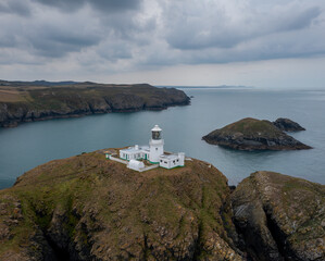 Poster - landscape view of the Pembrokeshire coast with the historic Strumble Head Lighthouse