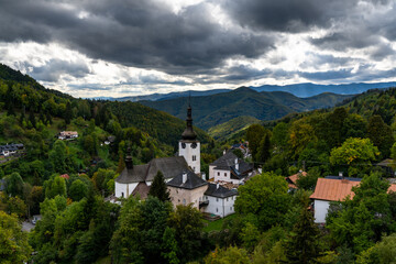 Sticker - view of the village and Roman Catholic church in Spania Dolina with green summer forest