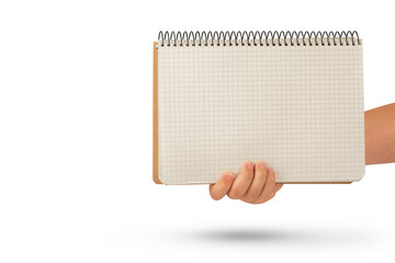 Wall Mural - Empty notepad in hand. A hand holds a blank notepad with copy space, isolated on a white background.