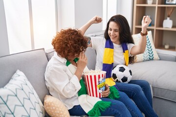 Poster - Two women mother and daughter supporting soccer match at home