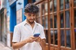 © Krakenimages.com - Young arab man using smartphone at street