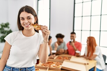 Sticker - Group of young people smiling happy eating italian pizza sitting on the table at home