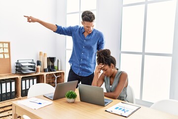 Wall Mural - Man and woman business workers firing employee at office