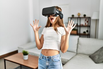 Sticker - Adorable girl playing video game using vr goggles at home