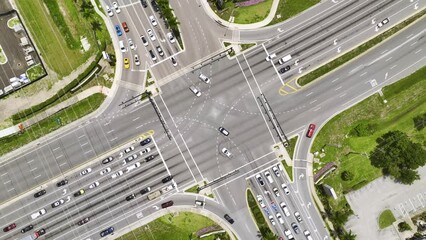 Poster - Aerial view of large multilane road intersection with traffic lights and moving cars and trucks