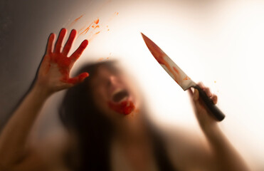 Poster - Woman killer with a knife in her hand. Creepy background