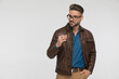 © Viorel Sima - cool young man with brown leather jacket looking to side
