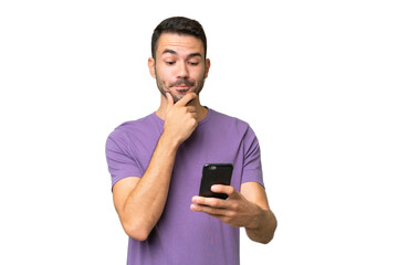 young handsome caucasian man over isolated background thinking and sending a message