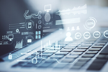 Close up of laptop with creative glowing business chart interface hologram on blurry background. Company digital data, guide and computer analysis concept. Double exposure.