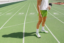 Athlete Holding Water Bottle At Sports Track