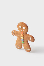 Decorated Gingerbread Man Standing Against White Background