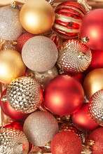 Red And Golden Christmas Baubles With Textured Surface