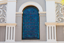 Stained Glass Arch Window Made Up Of Blue Scallop Design Or Pattern 