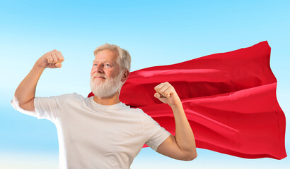 an old man retired superhero dressed in a red superhero cape