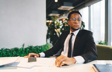 Sticker - Black businessman with cellphone in office