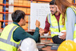 © Tongpool - Group of worker in the warehouse factory conduct toolbox talk daily meeting and argument brainstorm in the morning before start working
