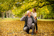 © BGStock72 - Grandfather spending time with his granddaughter in park on autumn day