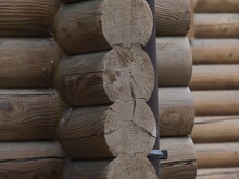 Corner Of A Wooden House Made Of Round Logs