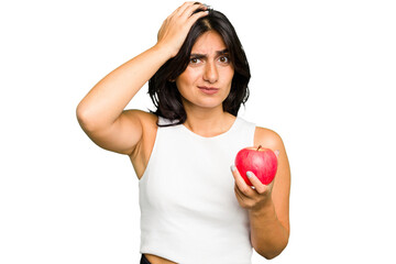 Wall Mural - Young Indian woman holding an apple, healthy lifestyle, isolated being shocked, she has remembered important meeting.