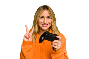 Wall Mural - Young caucasian gamer woman holding a game controller isolated on green chroma background showing number two with fingers.