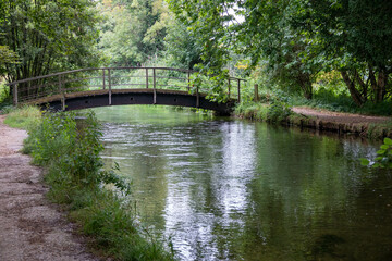 Wall Mural - rustic old footbridge over the River Test Hampshire England