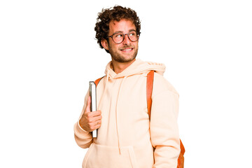 young caucasian student man isolated looks aside smiling, cheerful and pleasant.
