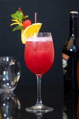 Canvas Print - Tasty cherry cocktail with oranges at the bar