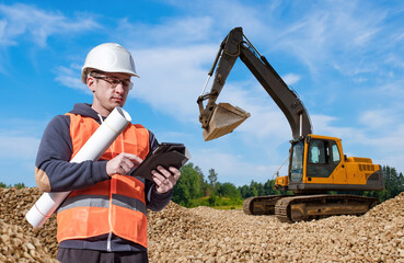 Preparation for construction. Man with tablet. Excavator driver away from machine. Man excavator driver. Concept site preparation for construction. Excavator driver inspecting construction site