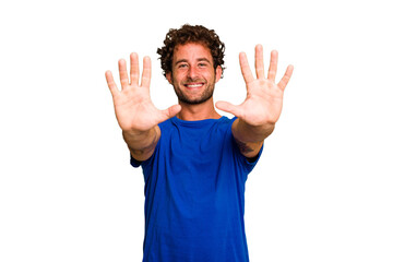 Wall Mural - Young caucasian curly hair man isolated Young caucasian man with curly hair isolated showing number ten with hands.