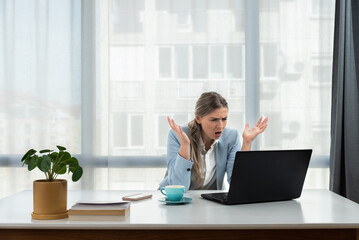 Wall Mural - Frustrated annoyed woman confused by computer problem, annoyed businesswoman feels indignant about laptop crash, bad news online or disgusting video on web, stressed student looking at broken pc