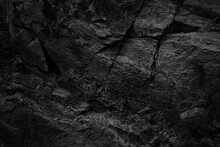 Black White Rock Texture With Cracks. Rough Surface Mountain Surface. Close-up. Dark Grey. Stone Granite Background With Space For Design. Grunge. Broken.