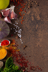 Wall Mural - Variety of spices and herbs at table background. Cooking concept and ingredients