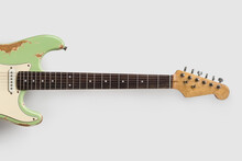Old Green Guitar On White Background. Vintage Music Wallpaper