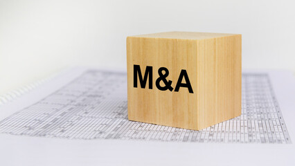 Poster - wooden block with letters M and A on white baclground. mergers and acquisitions concept