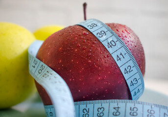 Wall Mural - Apple measuring tape on colored background