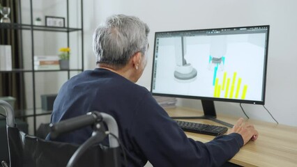 Senior asian man design robot arm at home. He using 3d program to work at living room. Automation, Technology, Development, Designer, Engineering Concept.