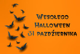 Fototapeta  - kartka lub baner na happy halloween party 31 października w kolorze czarnym na pomarańczowym tle z czarnymi nietoperzami